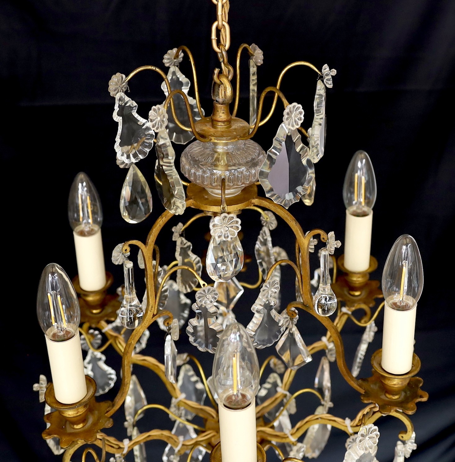 An early 20th century French gilt bronze and cut glass six light chandelier, height 54cm. width 40cm